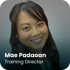 Smiling woman with long dark hair, wearing a dark top, is pictured against a gradient gray background. Text at the bottom reads, "Mae Padaoan, Training Director.